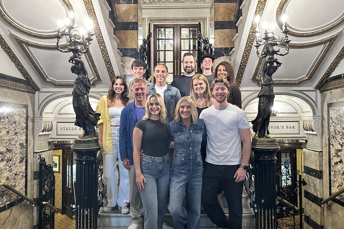 MAMMA MIA! London members of 2025-26 cast: Front row LtoR: Richard Standing (Sam), Ellie Kingdon (Sophie), Sara Poyzer (Donna) and George Maddison (Sky). Credit: Nathan Matthews.